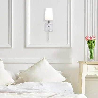 Modern gold iron led wall lamp with white cylindrical shade and polished chrome finish for bedroom decorbites iron led wall