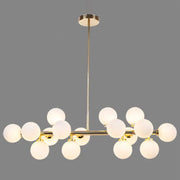Modern gold island pendant light with frosted glass globe bulbs in a symmetrical branching design for living room