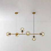 Modern gold island pendant light with brass chandelier design clear glass globe bulbs and black cords for dining room