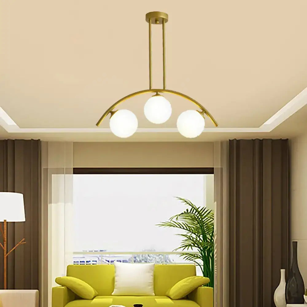 Decorbites gold island pendant with three clear white shade frosted glass bulbs in a modern curvy design