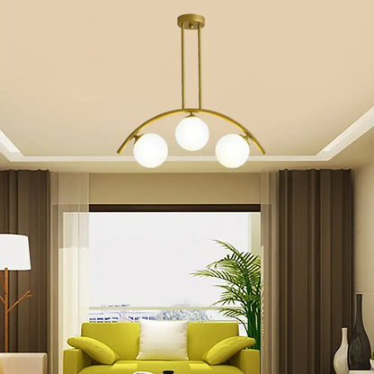 Decorbites gold island pendant with three clear white shade frosted glass bulbs in a modern curvy design