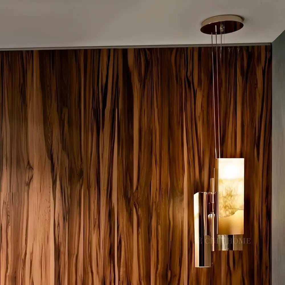 Modern gold italian marble pendant lamp with a warm glowing rectangular glass shade and polished brass decorbites italian marble accents