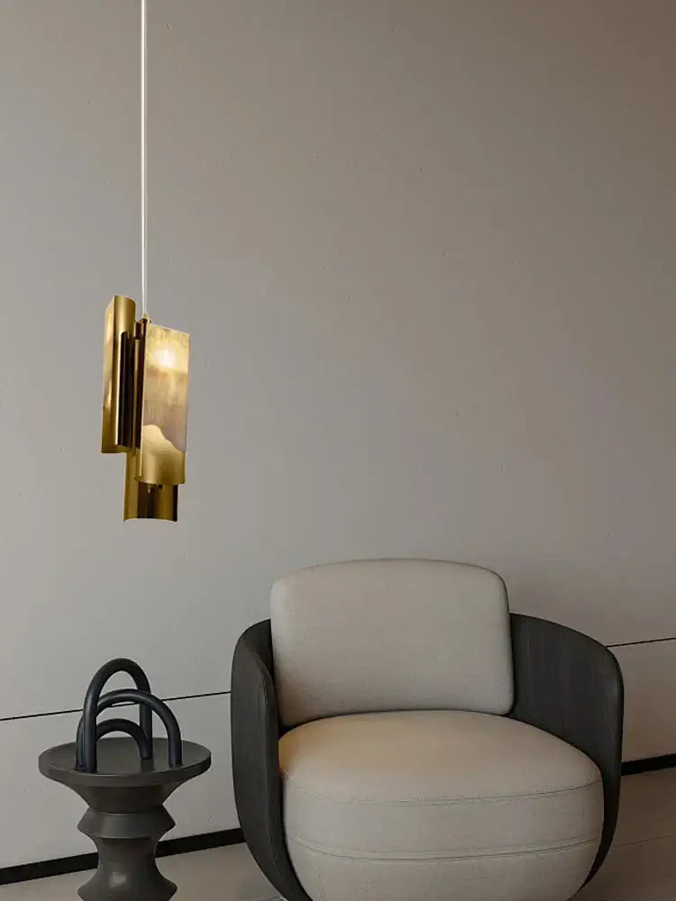 A modern gold-toned italian marble pendant lamp with a layered geometric design for dining room decorbites style