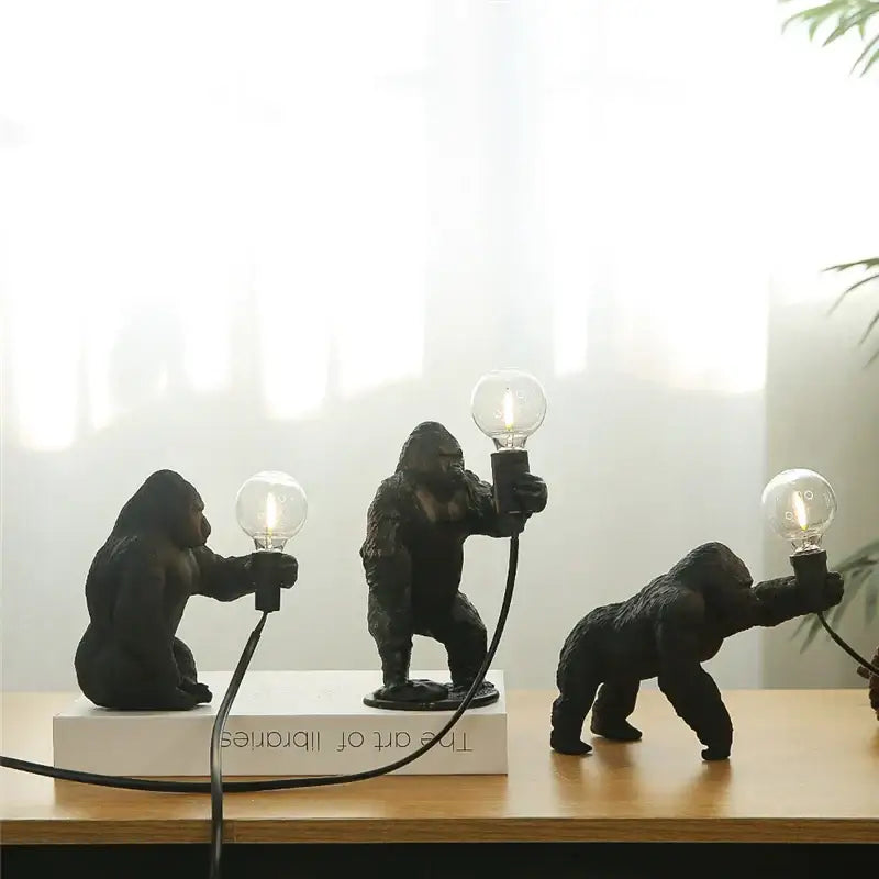 Modern gold king kong resin night light table lamps with black textured resin bodies and exposed filament bulbs decorbites king kong
