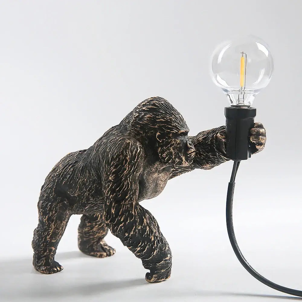 Bronze-finished king kong resin night light holding a clear glass bulb for modern decorbites king kong decor