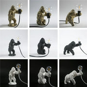 Modern gold king kong resin night light with detailed gorilla figurine holding filament bulb, decorbites king kong design
