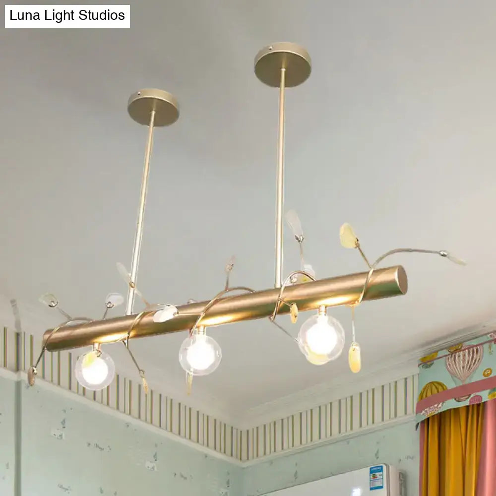 Gold-toned decorbites™ contemporary 3-light ceiling light with cylindrical bar and clear glass globe bulbs 110v-120v light type
