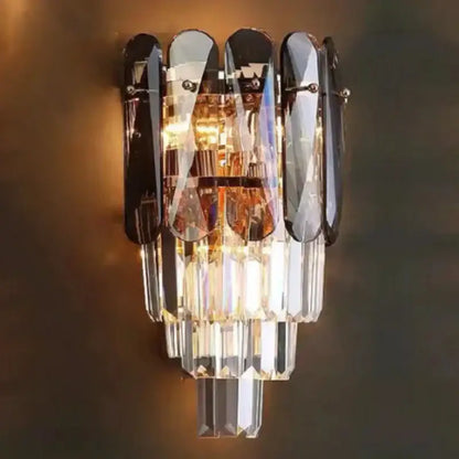 Modern gold leaf crystal wall lamp with cascading clear and amber prisms and black mirrored accents for bedroom decorbites crystal wall lighting