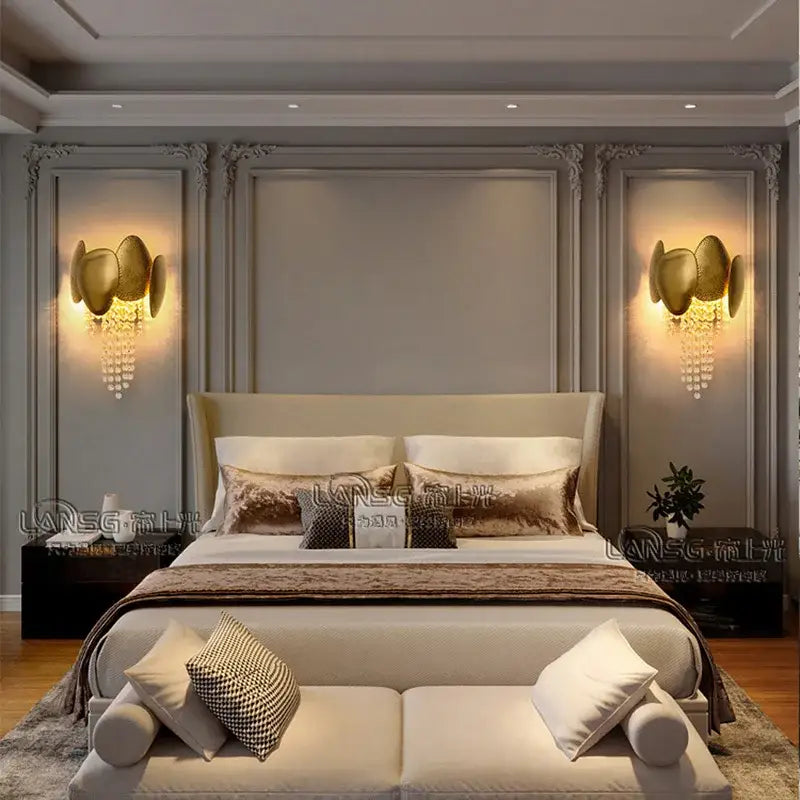 Modern gold-toned wall lamp with sculptural design and crystal accents ideal for decorbites crystal wall lighting
