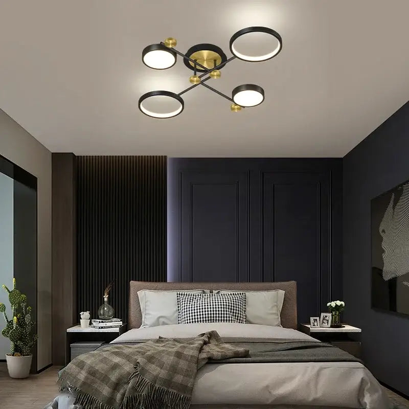 Modern black and gold circular ceiling lamp with six rings and a central brass hub featuring gold led ceiling lighting