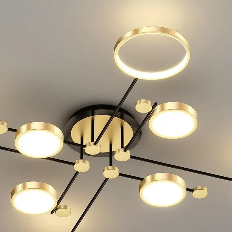 Modern gold led ceiling lamp with six circular bulbs and black arms for living room lighting