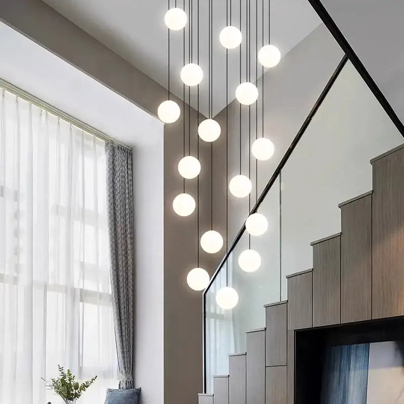 Modern gold led ceiling lamp chandelier with multiple spherical bulbs suspended by thin black cords for dining room decorbites led ceiling