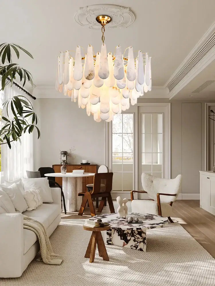 A modern gold led dimmable marble chandelier with cascading frosted glass teardrop shades for dining room use