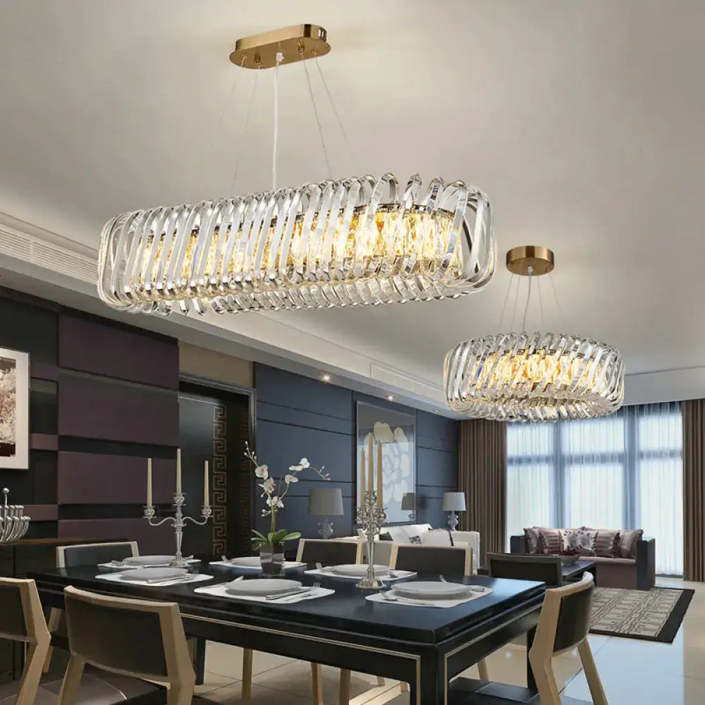 Modern rectangular decorbites led island pendant with clear crystal shade and gold-toned hanging light fixture
