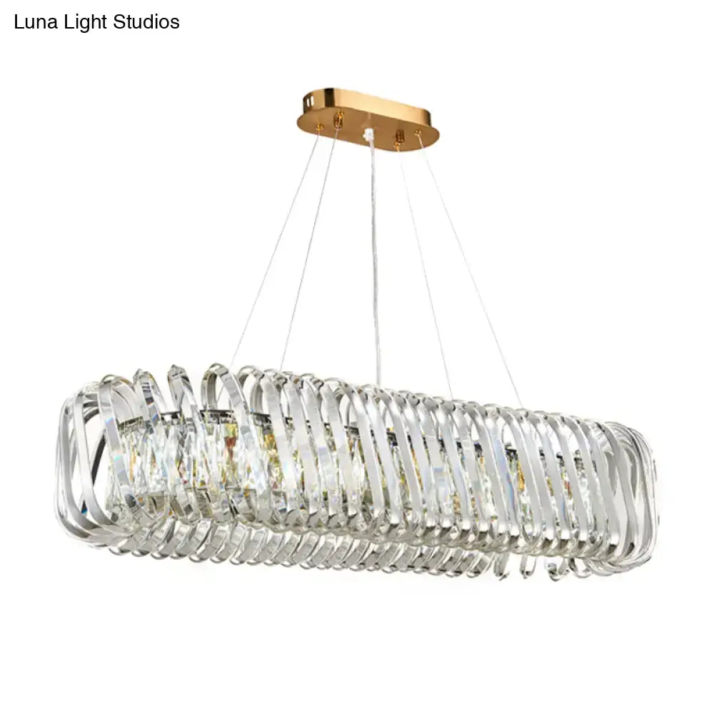 Elegant gold-toned DecorBites™ led island pendant with clear crystal shade and cascading strands hanging light fixture