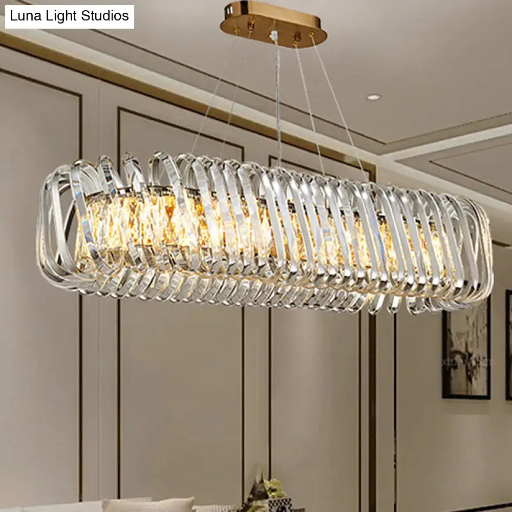 DecorBites™ led island pendant featuring a gold ceiling mount and clear crystal shade with hanging rods