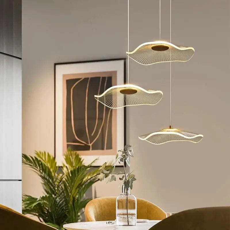Three modern gold led lotus chandelier pendant lights with leaf-shaped shades and wireframe design for dining room decorbites gold led