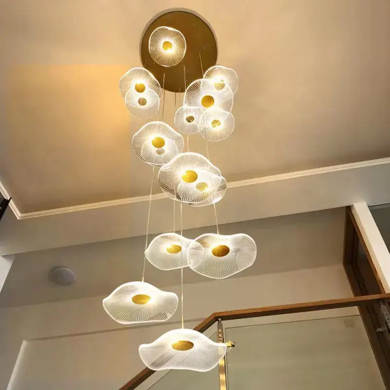 A modern gold led lotus chandelier with translucent white petal shades and gold centers for staircase and dining decorbites gold led