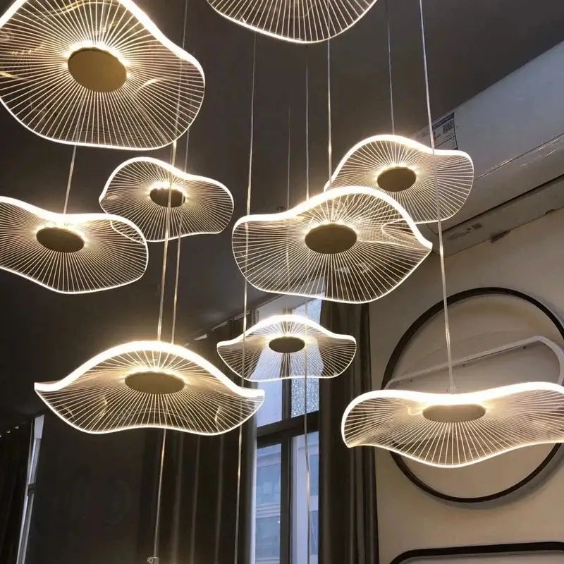 Modern gold led lotus chandelier featuring white fan-like pendant lights with glowing central illumination for decorbites gold led decor