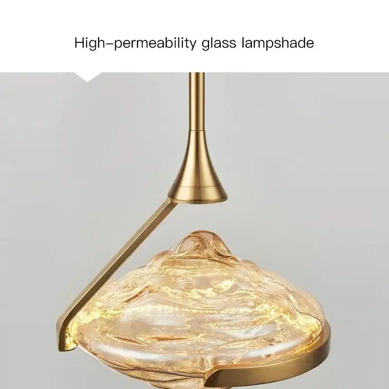 Modern gold led pendant lamp with a golden-toned high-permeability glass lampshade for dining room decorbites gold led