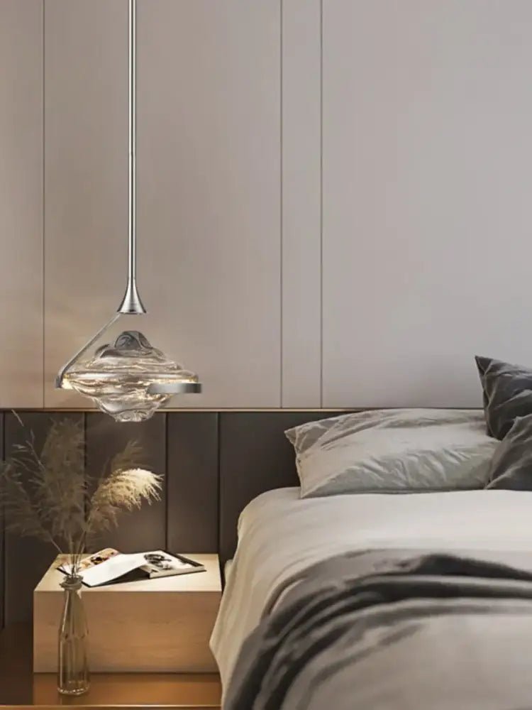 Modern gold led pendant lamp with a sleek silver stem and clear textured glass shade for dining room decorbites gold led