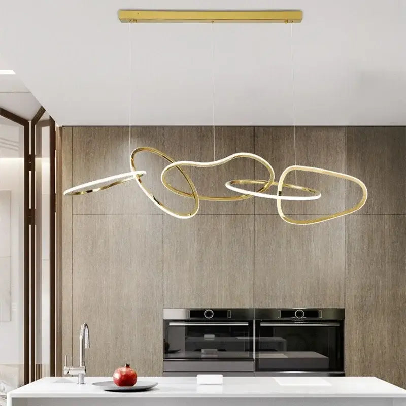 Modern gold led ring chandelier with interlocking circular rings pendant light above kitchen island decorbites gold led