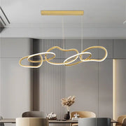 Modern gold led ring chandelier with interconnected flowing rings suspended from rectangular ceiling mount for dining room decorbites gold led