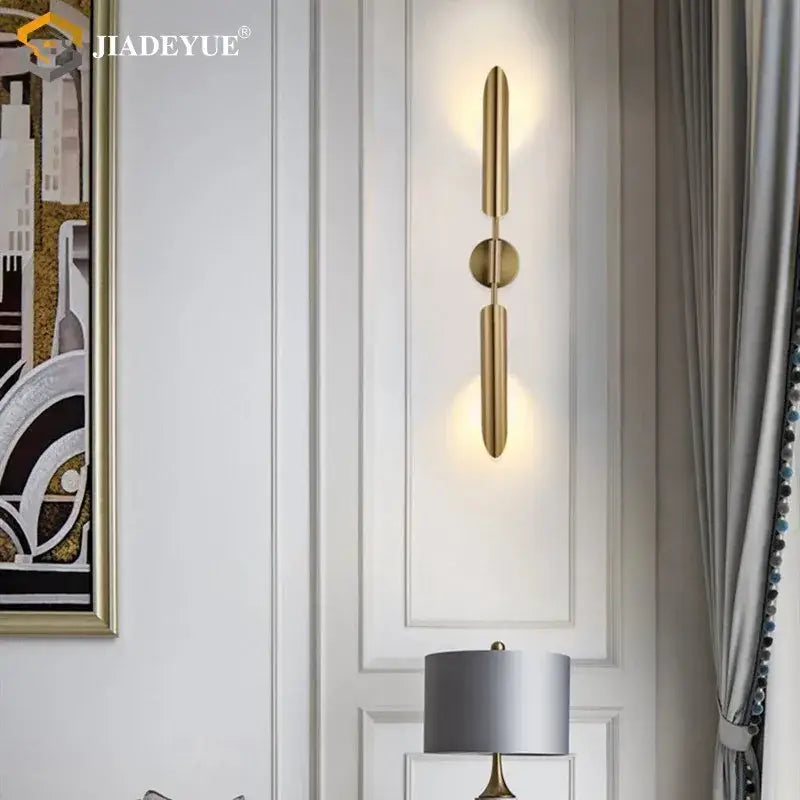 Modern gold led single head wall lamp with gold-toned sleek cylindrical arms decorbites gold led wall lamp for bedroom decor