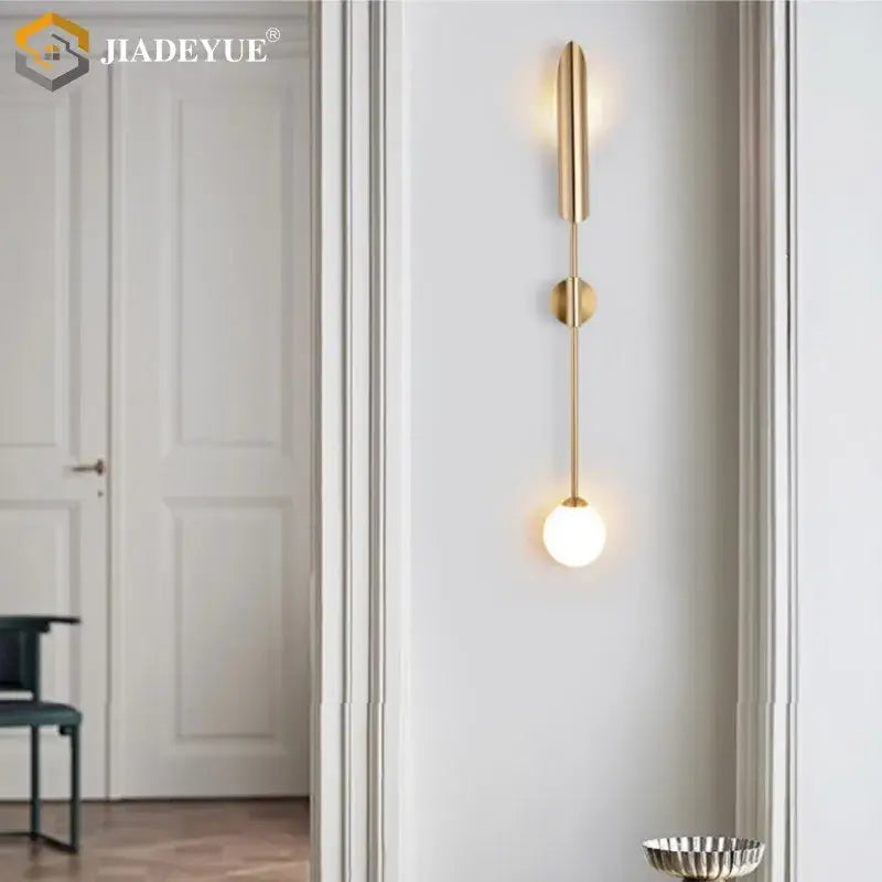 Modern gold led single wall lamp with sleek vertical design and illuminated glass bulb for bedroom decorbites gold led