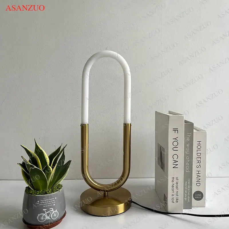 Modern gold led u shape table lamp with white ceramic top and brass base for bedroom art decor and minimalist design