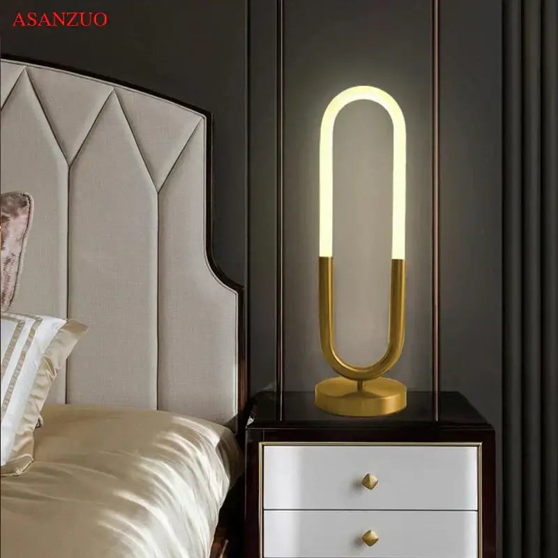 Modern gold led u shape table lamp with sleek curved design and warm glowing light for bedroom art decor