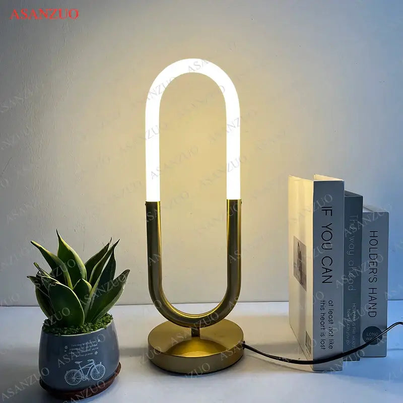 Modern gold led u shape table lamp with sleek curved led light tube and minimalist design for bedroom decor