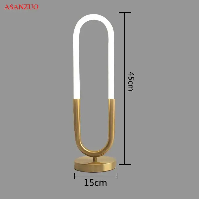 Modern gold led u shape table lamp with a sleek design and illuminated white led strip for bedroom art decor