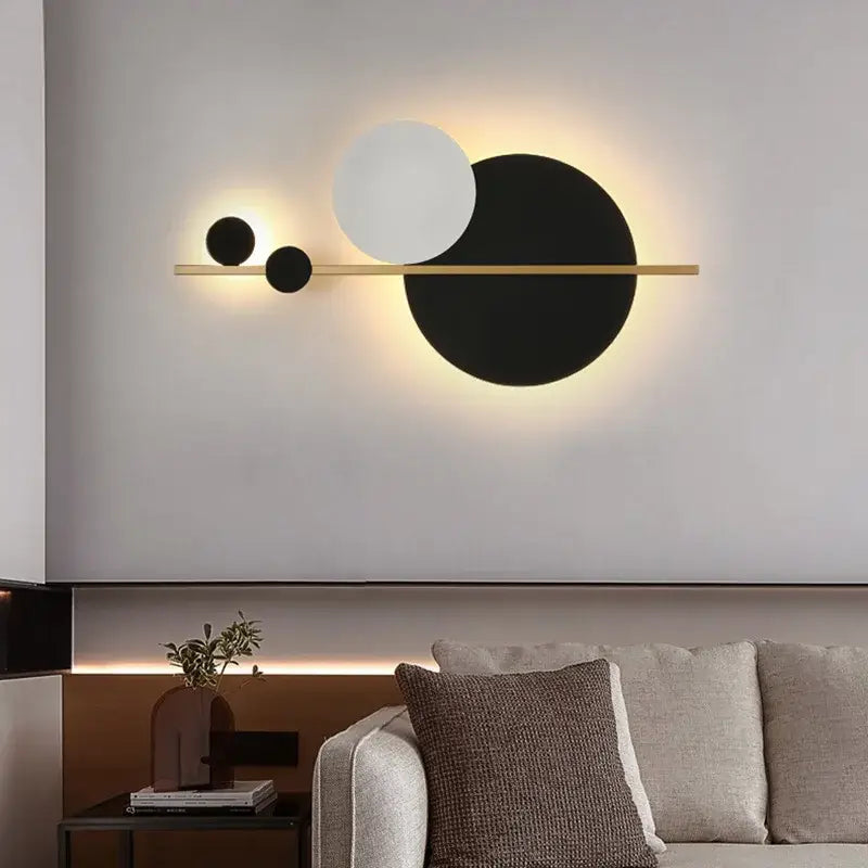 Modern gold led wall lamp with black and white circular shades on a slender bar for elegant bedroom decorbites led wall use