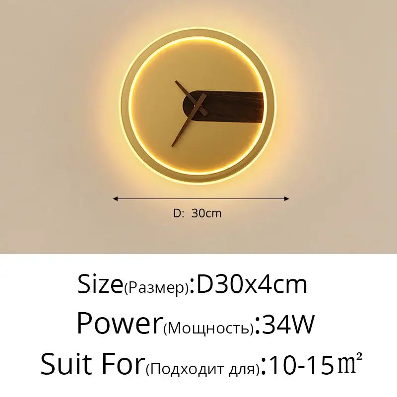 Modern gold led wall lamp clock with glowing golden frame and dark wood hands illuminated by led wall lighting
