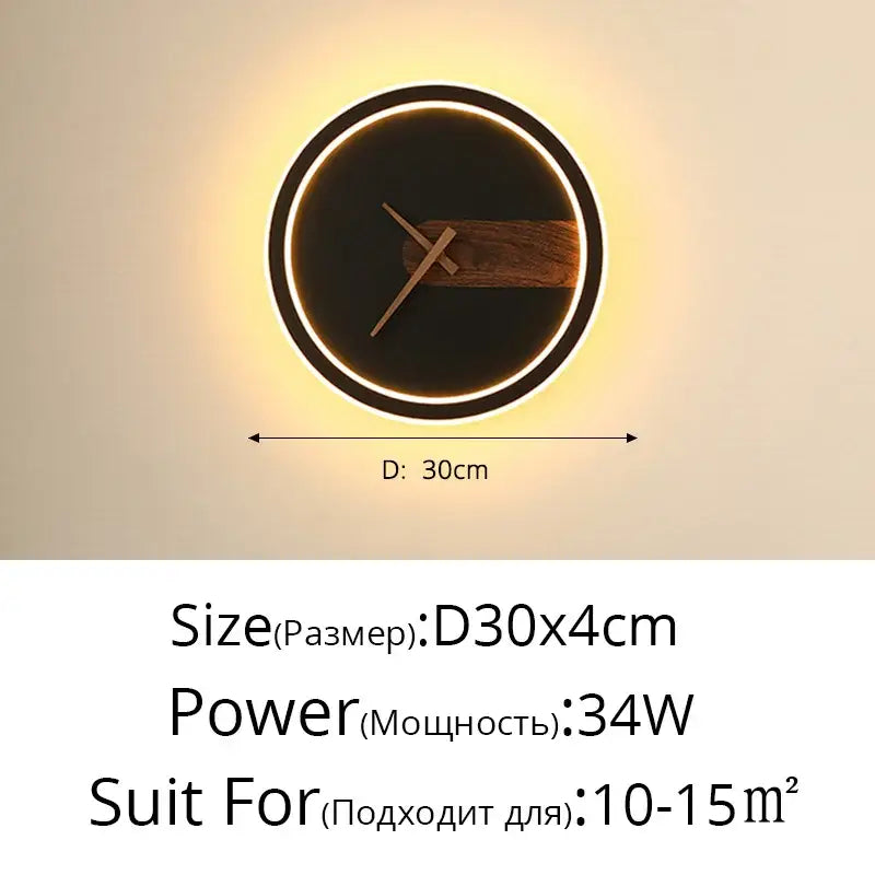 Modern gold led wall lamp clock featuring a circular black face, wooden accent bar, and illuminated led wall ring