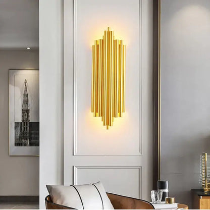 Modern gold led wall lamp featuring a golden metallic wall sconce with vertical cylindrical rods for living room decorbites gold led