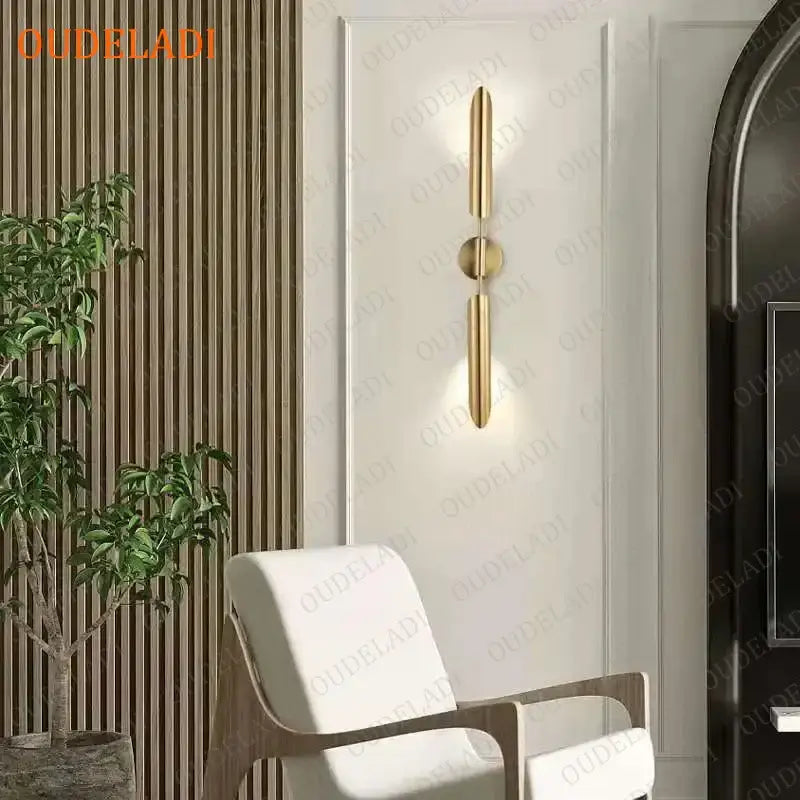 Modern gold led wall lamp with sleek vertical bars and circular accent featuring a spherical bulb for living room use