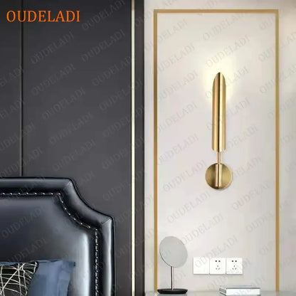 Modern gold led wall lamp with a minimalist cylindrical design and spherical bulb for living room use