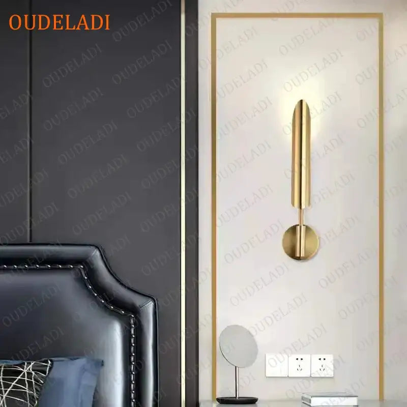 Modern gold led wall lamp with a minimalist cylindrical design and spherical bulb for living room use