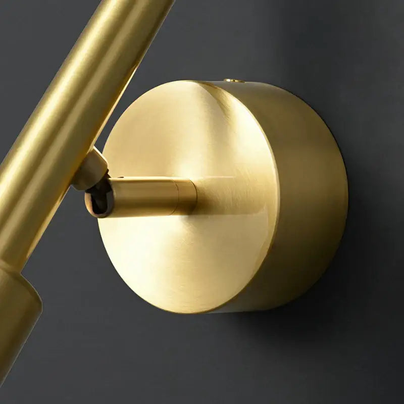 Gold-finished brass led wall lamp with adjustable arm and 3 color temperature settings for modern bedroom lighting