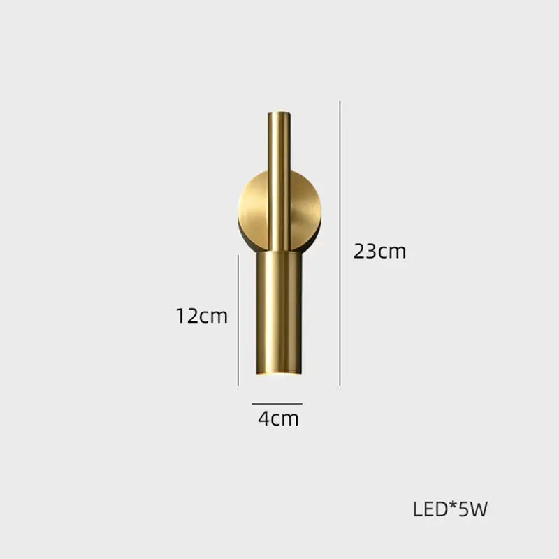 A sleek modern gold brass led wall lamp with cylindrical stem and color temperature for bedroom lighting