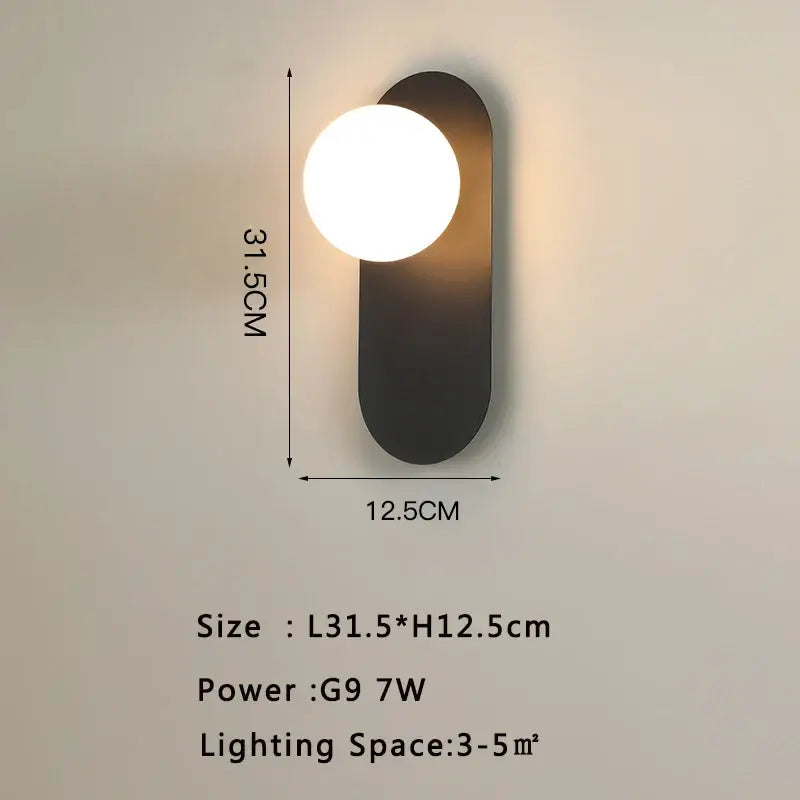 Modern matte black led wall lamp with elongated oval base and frosted glass bulb for living room lighting