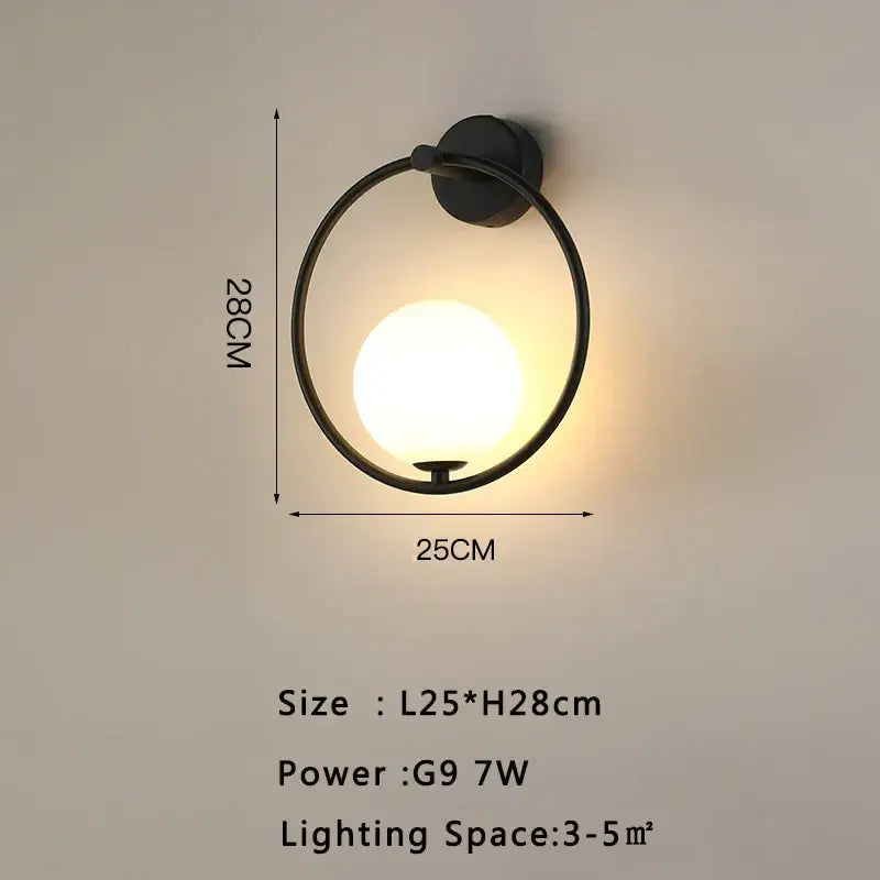 Black circular led wall lamp with warm glowing spherical bulb and frosted glass for modern living room lighting