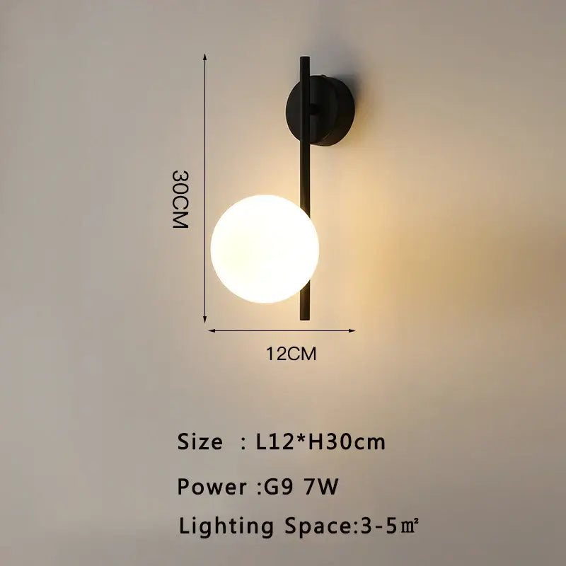 Black modern led wall lamp with spherical frosted glass globe and minimalist metal arm for living room use
