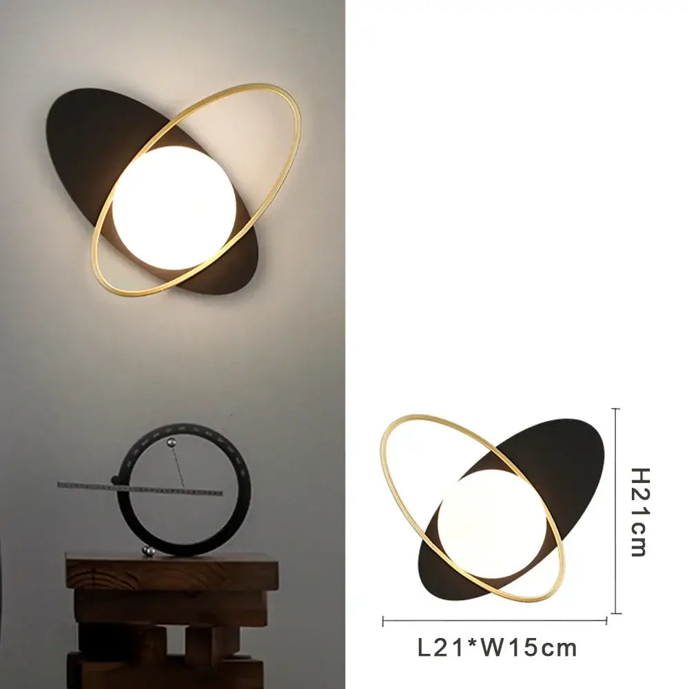 Modern gold and black led wall lamp with frosted glass and glowing circular light for living room use