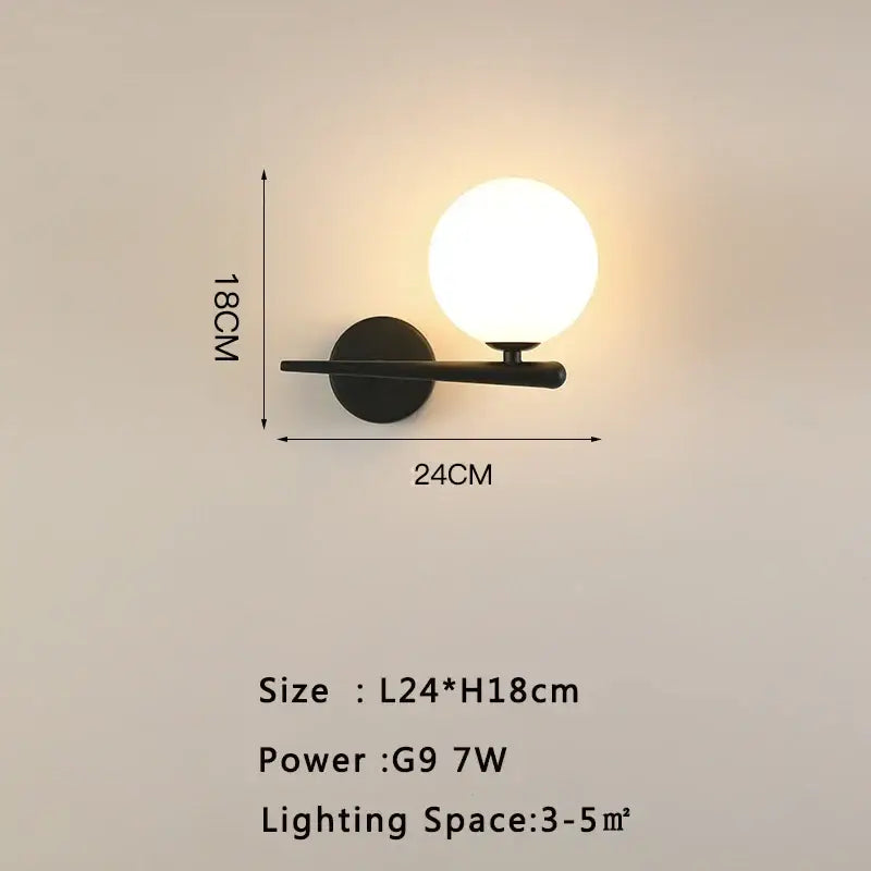Black minimalist led wall lamp with frosted glass globe and matte finish arm for modern living room lighting