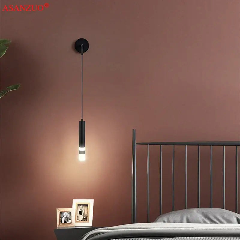 Modern gold led wall lamps featuring a black cylindrical pendant with warm led illumination for stylish decorbites led wall lighting