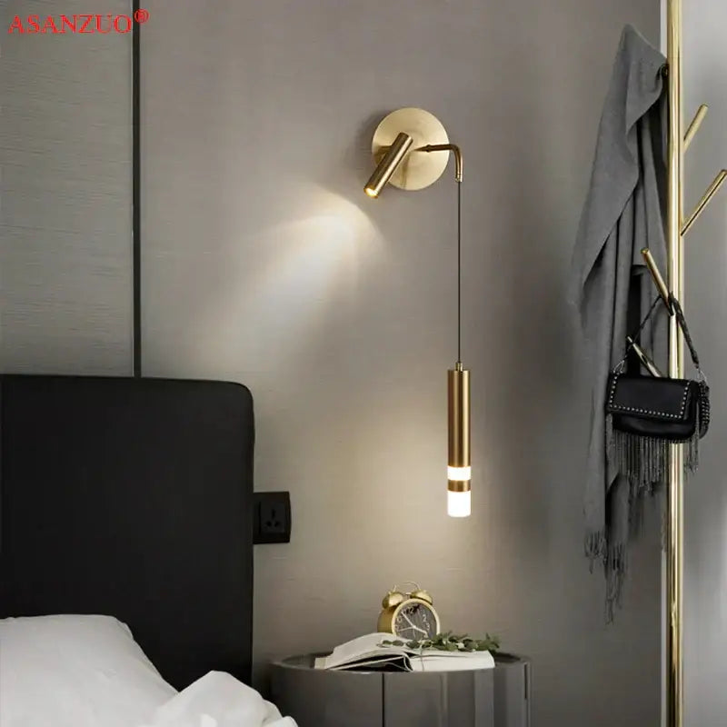 Modern gold led wall lamps featuring a gold-toned wall-mounted sconce with a cylindrical pendant light by decorbites led wall
