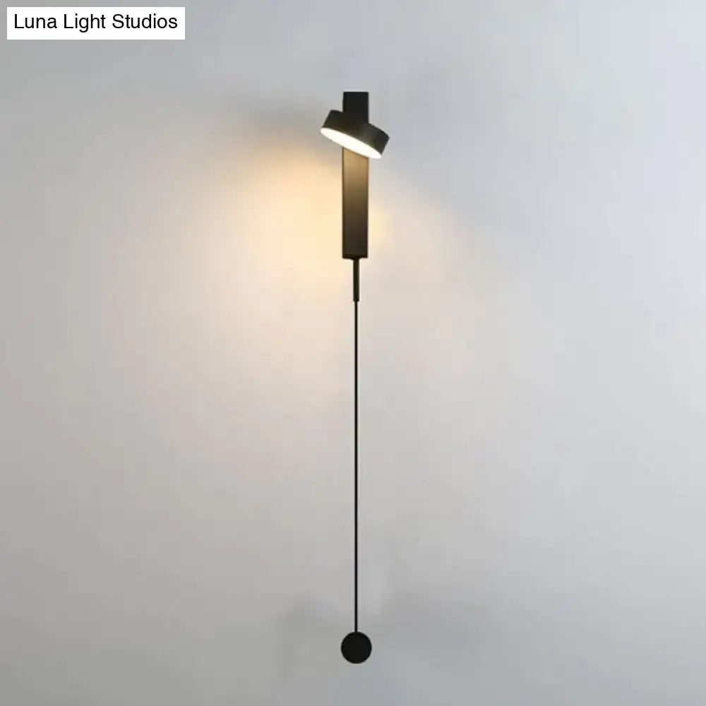 Modern black led wall lamp with sleek minimalist design, angular light head, and rotating sconce for bedroom use